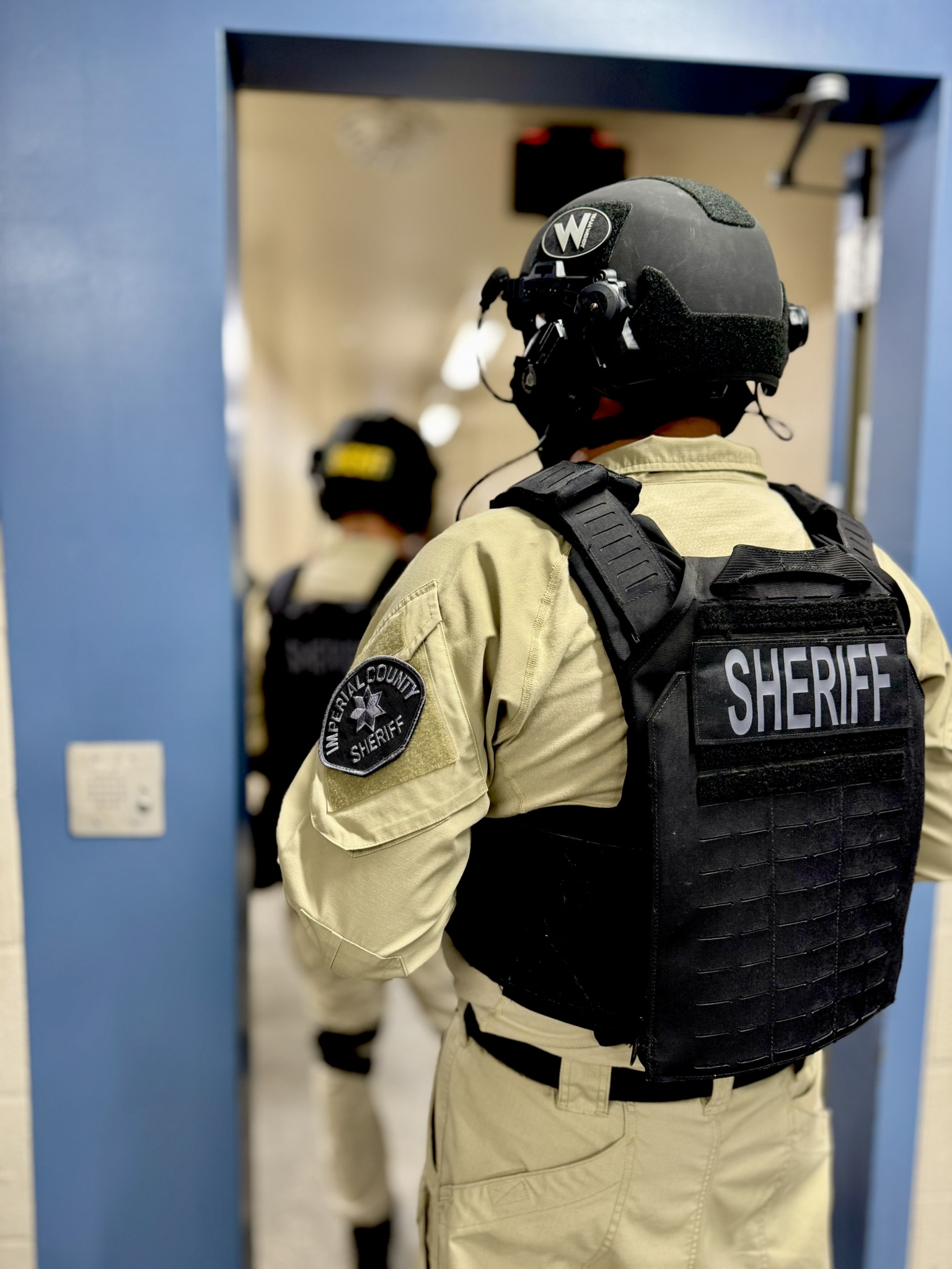 C-SORT team members at a doorway during a training exercise