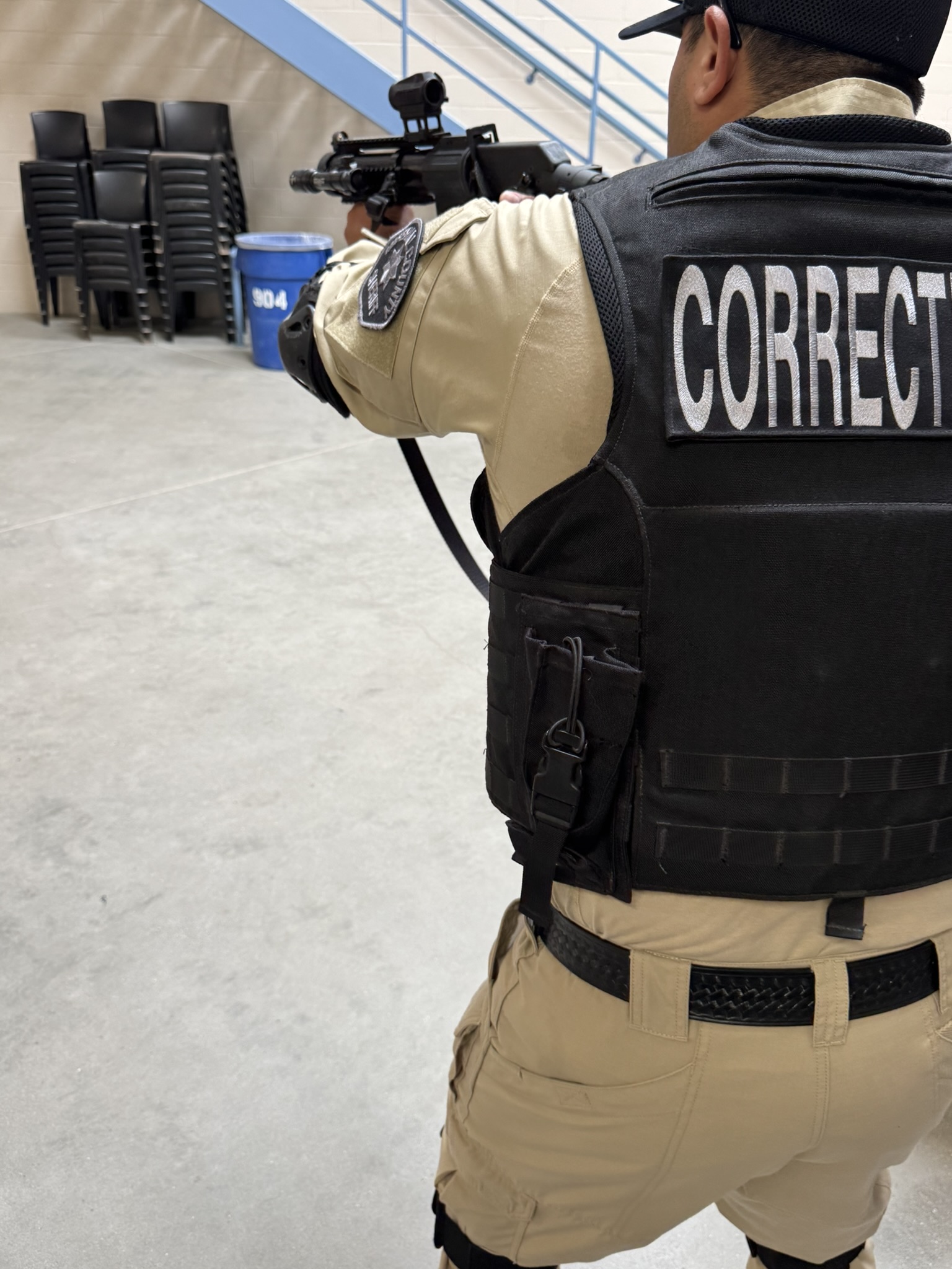 Corrections officer with training rifle during a C-SORT exercise